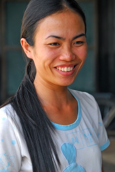 Woman at a motorbike washing station